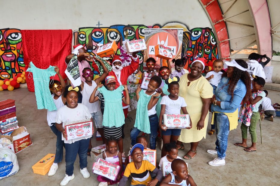 Children holding shoeboxes with presents